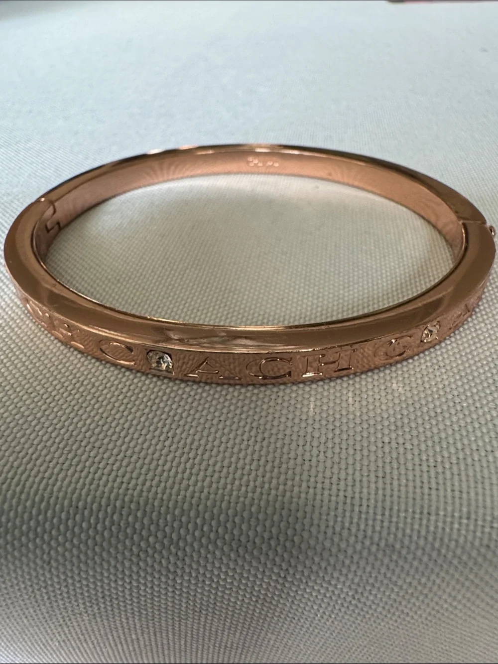 Coach Rose Gold-Tone Hinged Logo Bangle with Crystal Accents